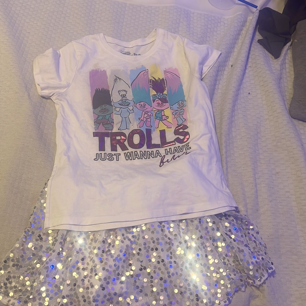 I’m selling a trolls world tour shirt with a beautiful glittery skirt with it.